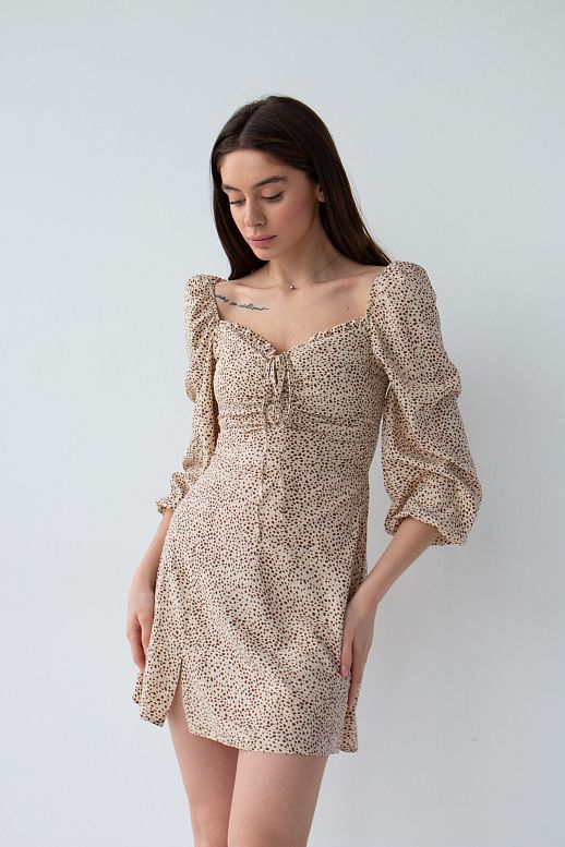Beige mini dress in dots with slit