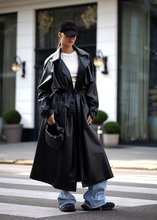 Black eco-leather trench coat on suede