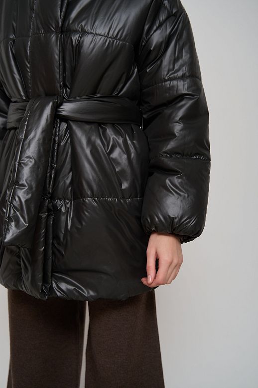 Elongated high collar coat lacquered black with buttons