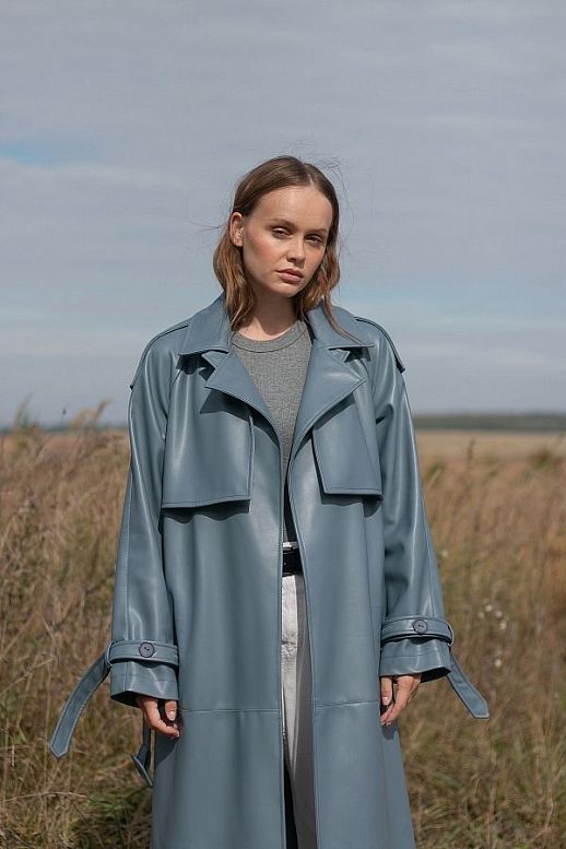 Blue eco-leather trench coat on suede